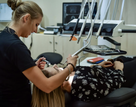 Female Dentist with a Patient